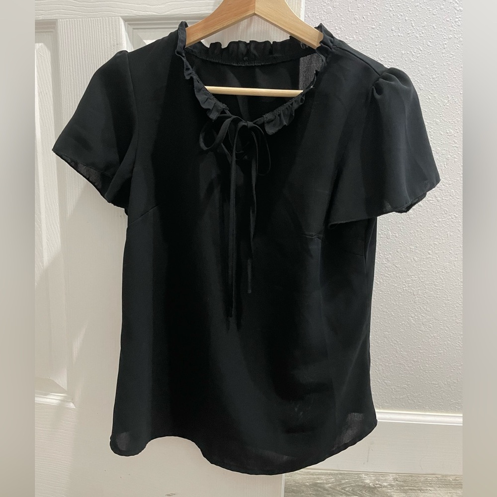 black blouse with tie in front